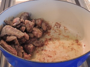 Once browned, move to the side