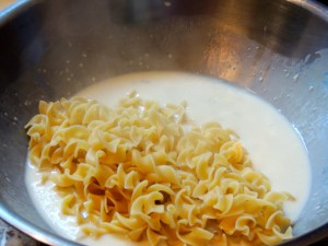 Add hot noodles to soup/milk mixture...