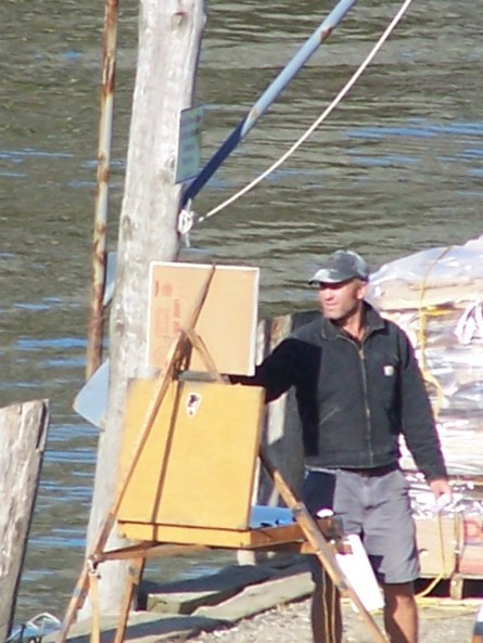 Tim Bell painting on the wharf, Monhegan
