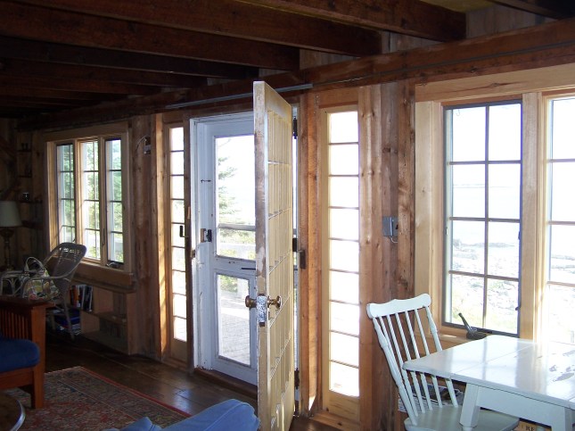 Wide door that goes out onto oceanside porch