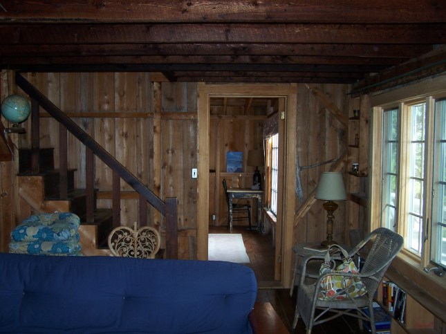 View standing near dining, looking through living towards bedroom...