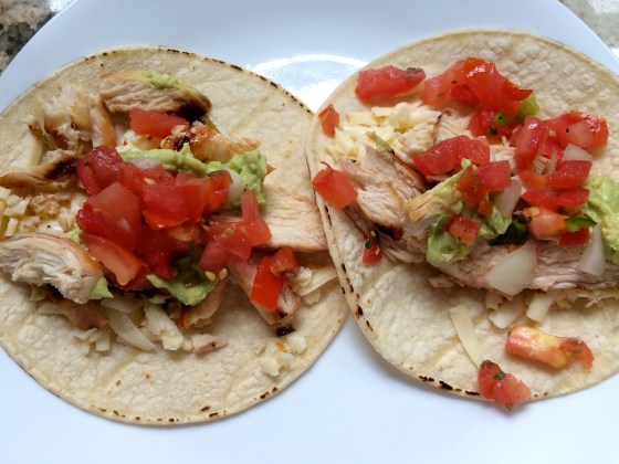Corn tortillas with chicken, cheese, salsa and guac