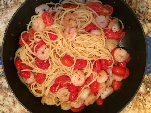 Shrimp and roasted tomatoes with pasta and feta