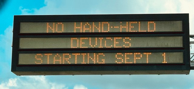 highway sign, no hand-held devices starting sept 1, new law