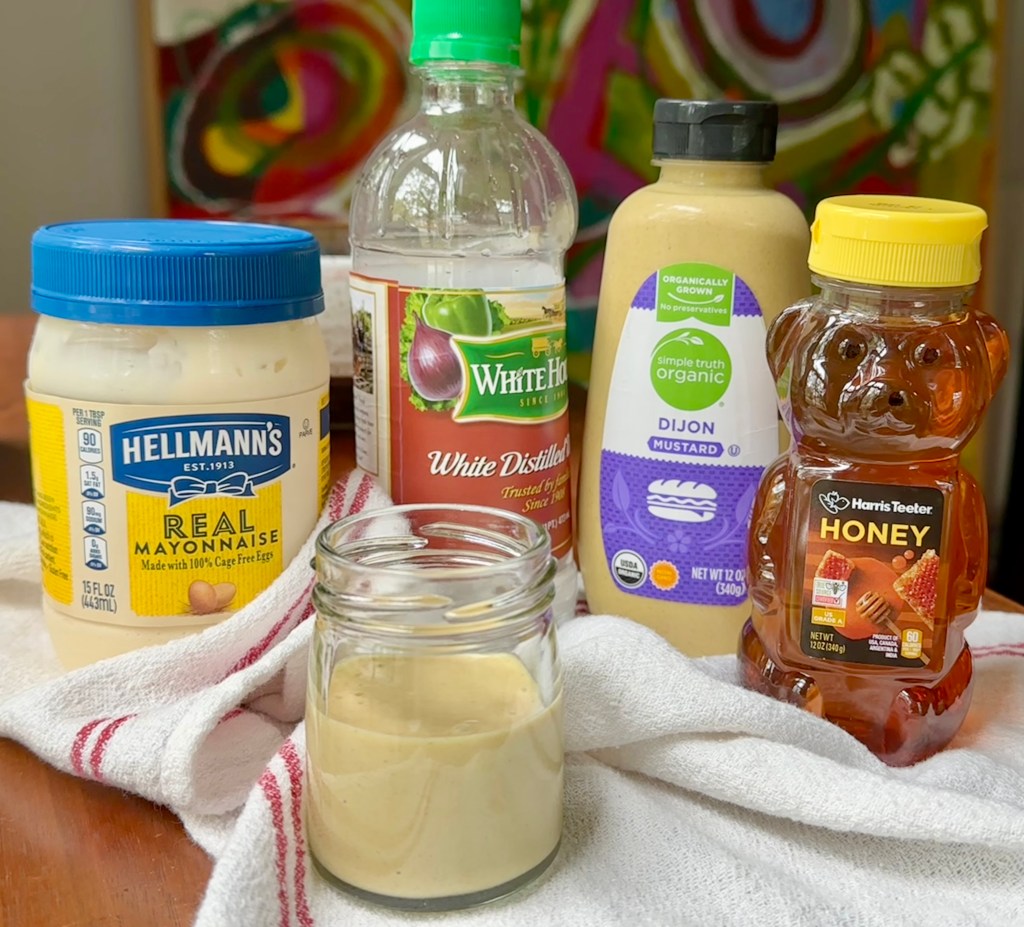 honey mustard sauce in glass jar with ingredients mayonnaise, white vinegar, dijon mustard and honey