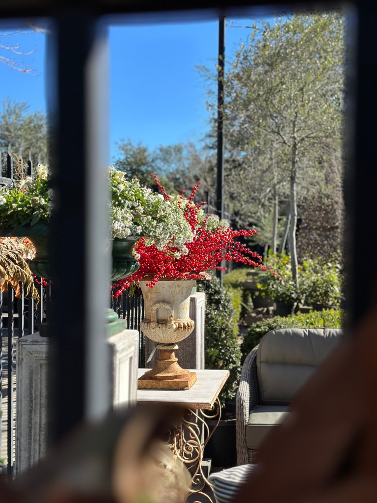 vintage earn, red berries, fence with roping for the holidays