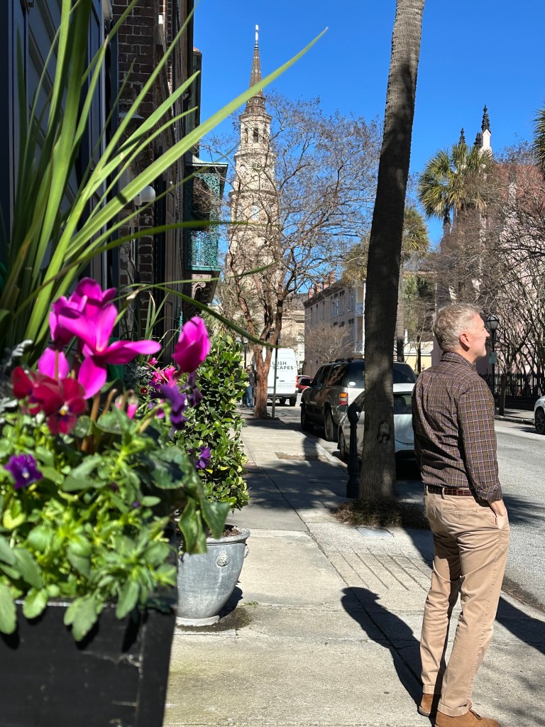 Charleston, SC street view with St. Phillips church in background. Window boxes. Winter.